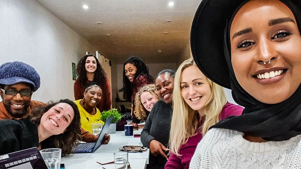 Impact Brixton community members smiling together