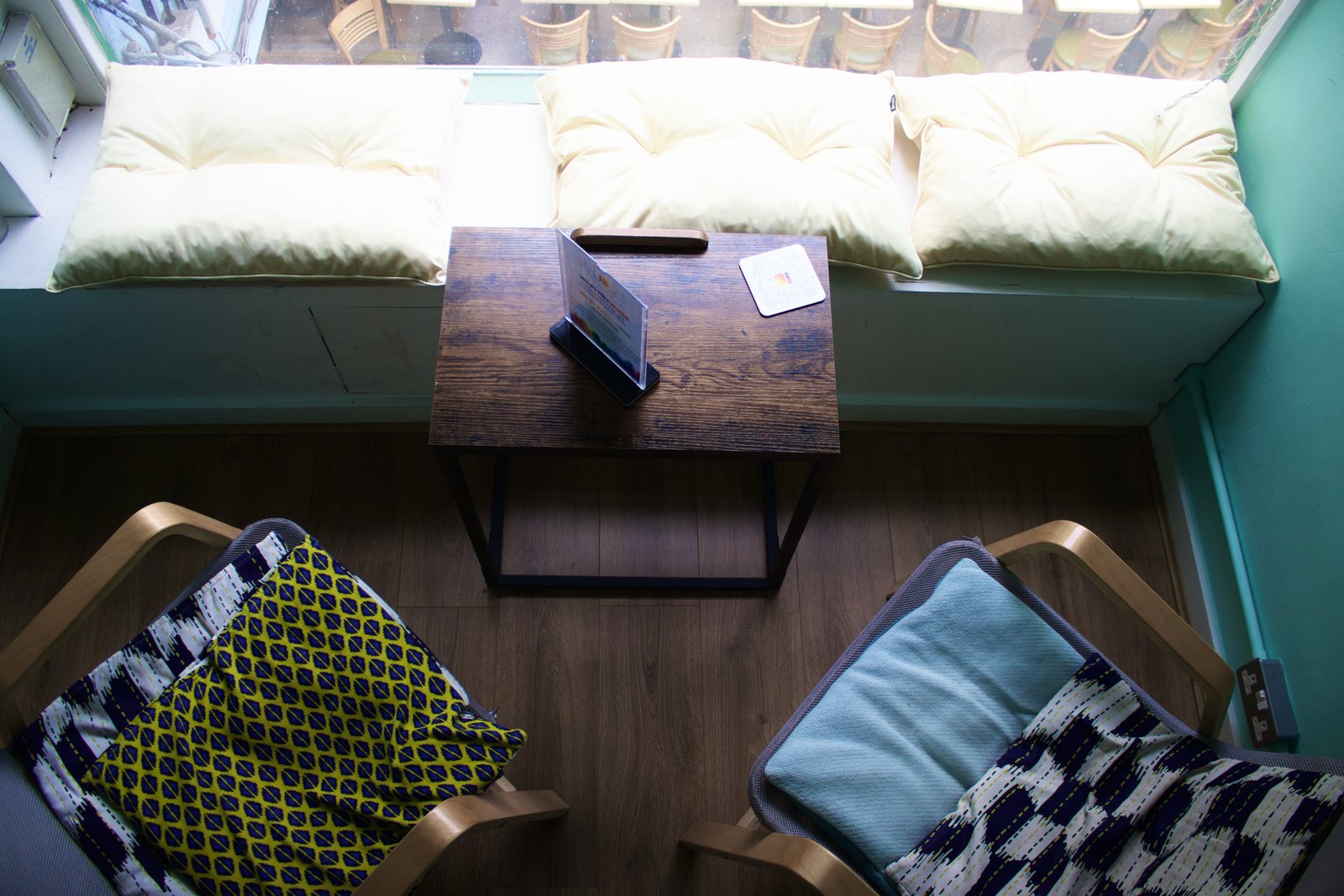 Bird's-eye view of The Den coaching room at Impact Brixton