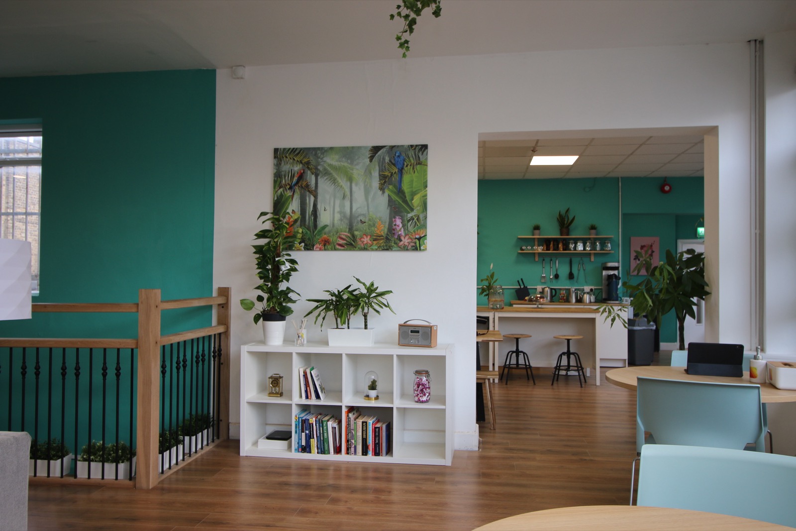 Members chatting over tea and cakes in the Impact Brixton kitchen