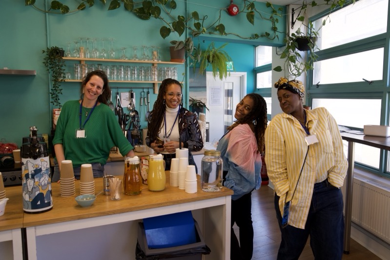 Impact Brixton hosts together in the kitchen and reception area