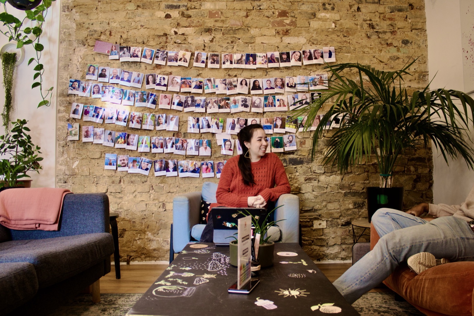 Member wall of happy faces in the Lounge